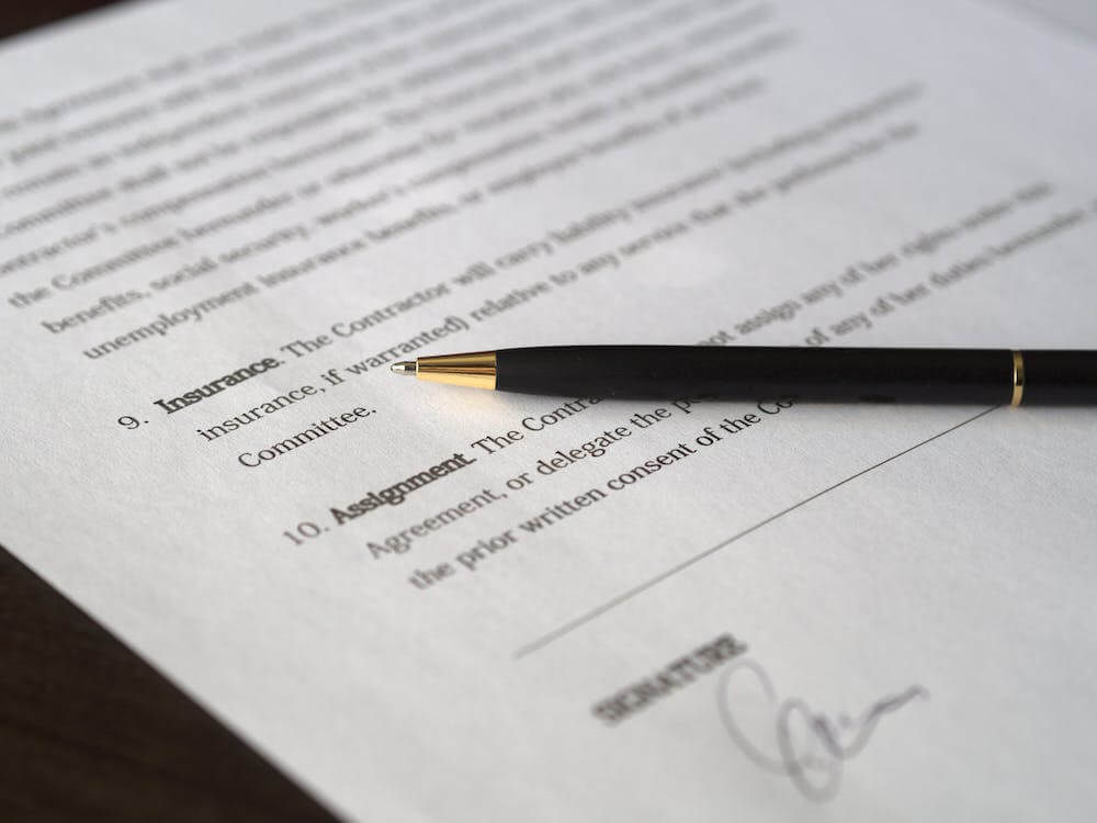 A form shown as a sheet of paper with a pen resting on top.