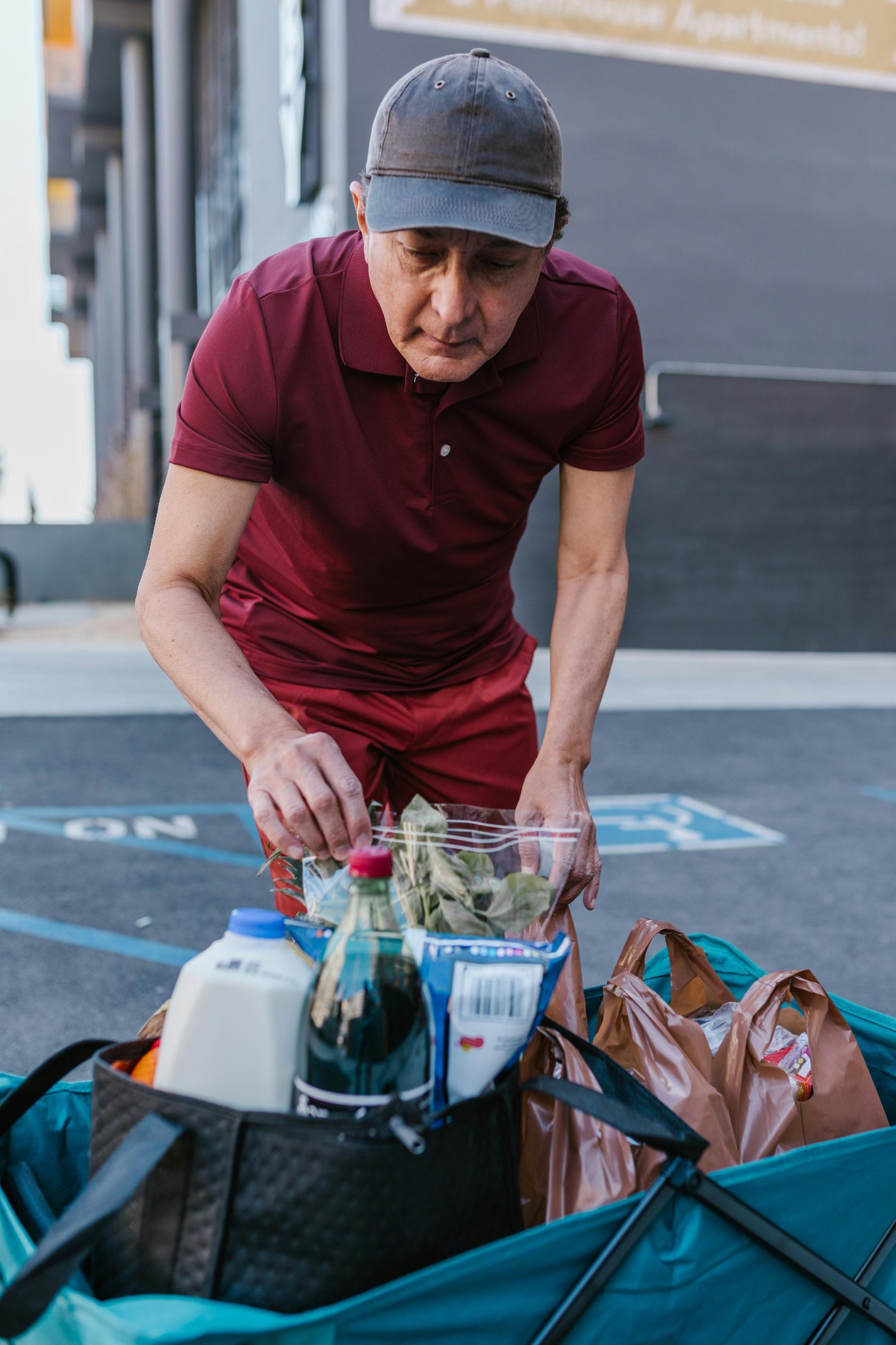 A person holding grocery bags.